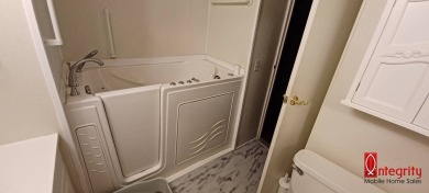 Come settle down and relax in a beautiful manufactured home with on Fairways Country Club in Florida - for sale on GolfHomes.com, golf home, golf lot