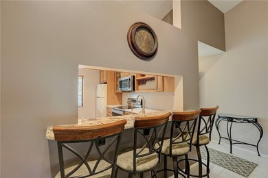 Beautifully furnished condo in gated community East of US 1 on Pelican Pointe 9 Hole Course in Florida - for sale on GolfHomes.com, golf home, golf lot