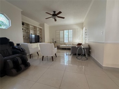 Welcome to your immaculate retreat within the gated and guarded on Hunters Creek Golf Course in Florida - for sale on GolfHomes.com, golf home, golf lot