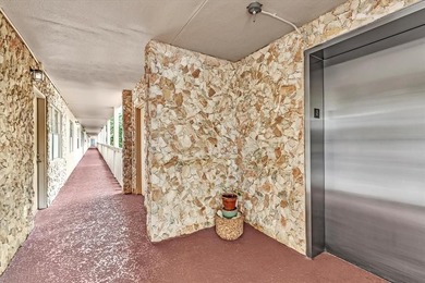 Experience unparalleled luxury in this reduced price *stunning* on Wynmoor Golf Course in Florida - for sale on GolfHomes.com, golf home, golf lot