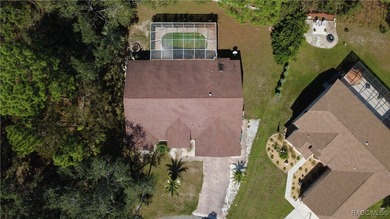 Charming 3-bedroom, 2-bathroom pool home nestled in the serene on Sugarmill Woods Golf and Country Club in Florida - for sale on GolfHomes.com, golf home, golf lot