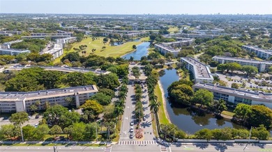 Experience unparalleled luxury in this reduced price *stunning* on Wynmoor Golf Course in Florida - for sale on GolfHomes.com, golf home, golf lot