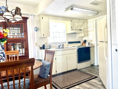 Beautifully nestled ground floor condo among the natural beauty on Country Club At Silver Springs Shores in Florida - for sale on GolfHomes.com, golf home, golf lot