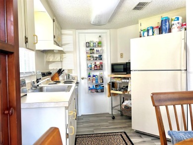 Beautifully nestled ground floor condo among the natural beauty on Country Club At Silver Springs Shores in Florida - for sale on GolfHomes.com, golf home, golf lot