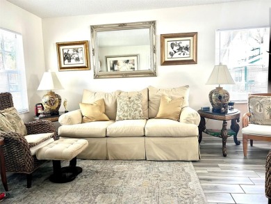 Beautifully nestled ground floor condo among the natural beauty on Country Club At Silver Springs Shores in Florida - for sale on GolfHomes.com, golf home, golf lot