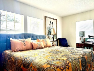 Beautifully nestled ground floor condo among the natural beauty on Country Club At Silver Springs Shores in Florida - for sale on GolfHomes.com, golf home, golf lot