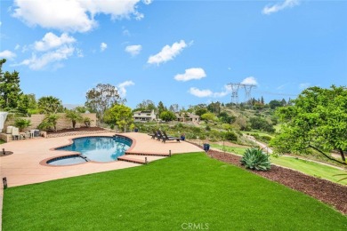 Welcome to this stunning residence overlooking the lush greens on Anaheim Hills Golf Course in California - for sale on GolfHomes.com, golf home, golf lot