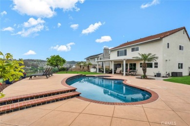 Welcome to this stunning residence overlooking the lush greens on Anaheim Hills Golf Course in California - for sale on GolfHomes.com, golf home, golf lot