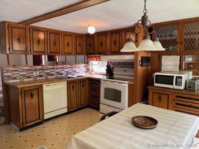 Nice Mobile Home In Country Club Estates. Home offers covered on The University Club of Connecticut in Connecticut - for sale on GolfHomes.com, golf home, golf lot