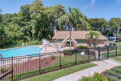 Beautifully updated and move-in ready, this 2-bedroom, 2-bath on Highland Lakes Executive Golf Course in Florida - for sale on GolfHomes.com, golf home, golf lot