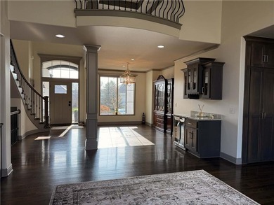 Welcome to an exceptional 1.5-story residence, perfectly on Tiffany Greens Golf Club in Missouri - for sale on GolfHomes.com, golf home, golf lot