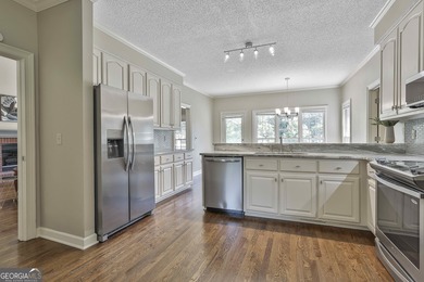 Enjoy the golf course views from this beautifully updated 4bd/3 on Canongate On White Oak Golf Course in Georgia - for sale on GolfHomes.com, golf home, golf lot