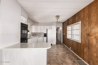 Charming home with great spaces and open layout! Large garage on Fountain of the Sun Country Club in Arizona - for sale on GolfHomes.com, golf home, golf lot