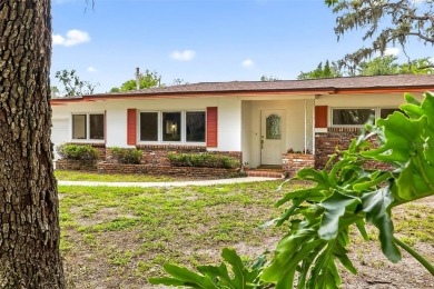 Come see this well-maintained 3-bedroom, 2.5-bath midcentury on Temple Terrace Golf and Country Club in Florida - for sale on GolfHomes.com, golf home, golf lot