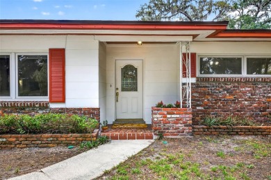 Come see this well-maintained 3-bedroom, 2.5-bath midcentury on Temple Terrace Golf and Country Club in Florida - for sale on GolfHomes.com, golf home, golf lot