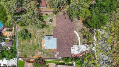 Come see this well-maintained 3-bedroom, 2.5-bath midcentury on Temple Terrace Golf and Country Club in Florida - for sale on GolfHomes.com, golf home, golf lot