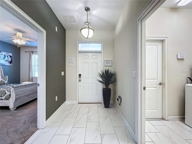 WALKING DISTANCE TO THE CLUBHOUSE. This beautifully designed on The Oasis Club at Champions Gate in Florida - for sale on GolfHomes.com, golf home, golf lot