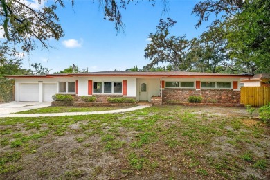 Come see this well-maintained 3-bedroom, 2.5-bath midcentury on Temple Terrace Golf and Country Club in Florida - for sale on GolfHomes.com, golf home, golf lot