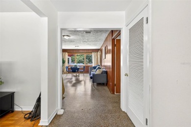 Come see this well-maintained 3-bedroom, 2.5-bath midcentury on Temple Terrace Golf and Country Club in Florida - for sale on GolfHomes.com, golf home, golf lot