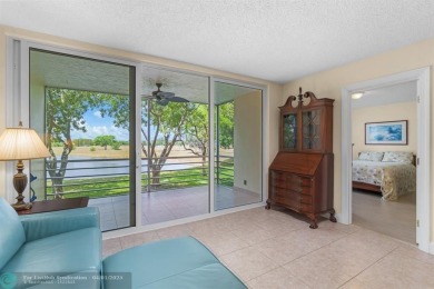 Enjoy a Serene Lake View from this Super Clean, Bright 2nd Floor on Palm-Aire Country Club and Resort - Palms in Florida - for sale on GolfHomes.com, golf home, golf lot