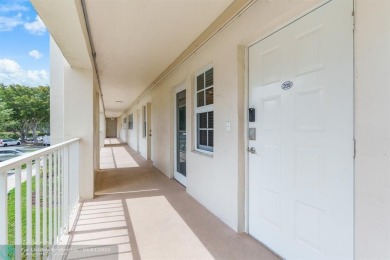 Enjoy a Serene Lake View from this Super Clean, Bright 2nd Floor on Palm-Aire Country Club and Resort - Palms in Florida - for sale on GolfHomes.com, golf home, golf lot