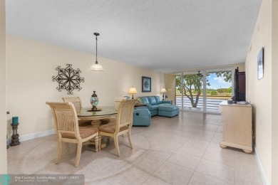 Enjoy a Serene Lake View from this Super Clean, Bright 2nd Floor on Palm-Aire Country Club and Resort - Palms in Florida - for sale on GolfHomes.com, golf home, golf lot