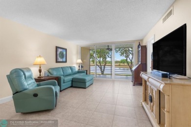 Enjoy a Serene Lake View from this Super Clean, Bright 2nd Floor on Palm-Aire Country Club and Resort - Palms in Florida - for sale on GolfHomes.com, golf home, golf lot