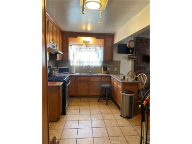 This home boasts of spacious kitchen, 3 bedrooms, 2 bathrooms on Los Amigos Country Golf Course in California - for sale on GolfHomes.com, golf home, golf lot