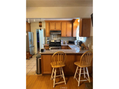 This home boasts of spacious kitchen, 3 bedrooms, 2 bathrooms on Los Amigos Country Golf Course in California - for sale on GolfHomes.com, golf home, golf lot