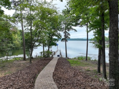 Welcome to this truly spectacular lakefront dream home in the on Old North State Club at Uwharrie Point Golf community in North Carolina - for sale on GolfHomes.com, golf home, golf lot