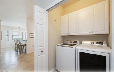 Discover this stunning top floor Bellini 2 BR + Den condo on Bonita National Golf Course in Florida - for sale on GolfHomes.com, golf home, golf lot