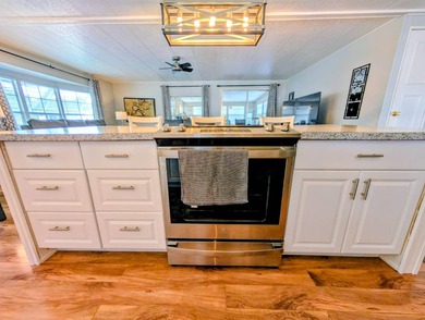 This immaculate home exudes charm and elegance, perfectly on Grasslands Golf and Country Club in Florida - for sale on GolfHomes.com, golf home, golf lot