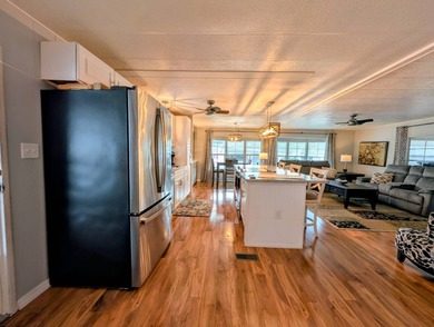 This immaculate home exudes charm and elegance, perfectly on Grasslands Golf and Country Club in Florida - for sale on GolfHomes.com, golf home, golf lot