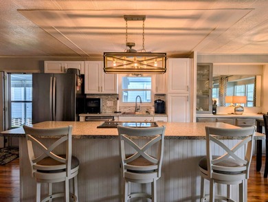 This immaculate home exudes charm and elegance, perfectly on Grasslands Golf and Country Club in Florida - for sale on GolfHomes.com, golf home, golf lot