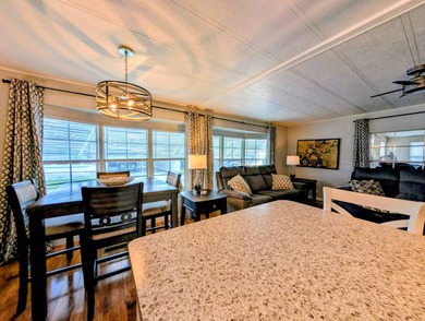 This immaculate home exudes charm and elegance, perfectly on Grasslands Golf and Country Club in Florida - for sale on GolfHomes.com, golf home, golf lot