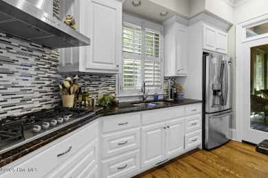 This beautiful brick home in River Landing seamlessly blends on River Landing Golf Course in North Carolina - for sale on GolfHomes.com, golf home, golf lot