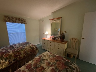 This well cared for home is furnished and includes the golf cart on Lake Fairways Country Club in Florida - for sale on GolfHomes.com, golf home, golf lot