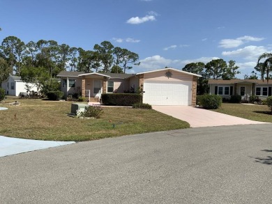 This well cared for home is furnished and includes the golf cart on Lake Fairways Country Club in Florida - for sale on GolfHomes.com, golf home, golf lot