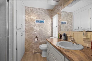 Indulge in breathtaking panoramic golf course views and on Maple Leaf Golf and Country Club in Florida - for sale on GolfHomes.com, golf home, golf lot
