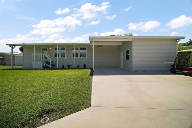Come see this WATERFRONT 2 BED / 2 BATH / BONUS ROOM on Bay Tree Golf Course in Florida - for sale on GolfHomes.com, golf home, golf lot