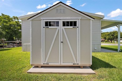 Come see this WATERFRONT 2 BED / 2 BATH / BONUS ROOM on Bay Tree Golf Course in Florida - for sale on GolfHomes.com, golf home, golf lot