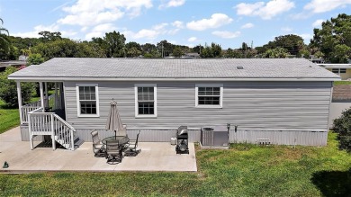 Come see this WATERFRONT 2 BED / 2 BATH / BONUS ROOM on Bay Tree Golf Course in Florida - for sale on GolfHomes.com, golf home, golf lot