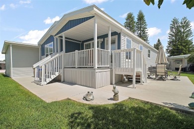 Come see this WATERFRONT 2 BED / 2 BATH / BONUS ROOM on Bay Tree Golf Course in Florida - for sale on GolfHomes.com, golf home, golf lot
