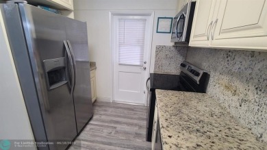 Experience South Florida living in this beautifully renovated on Palm-Aire Country Club and Resort - Palms in Florida - for sale on GolfHomes.com, golf home, golf lot