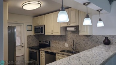 Experience South Florida living in this beautifully renovated on Palm-Aire Country Club and Resort - Palms in Florida - for sale on GolfHomes.com, golf home, golf lot