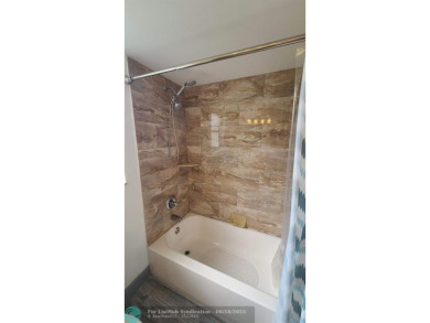 Experience South Florida living in this beautifully renovated on Palm-Aire Country Club and Resort - Palms in Florida - for sale on GolfHomes.com, golf home, golf lot