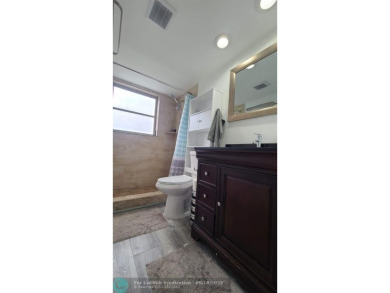 Experience South Florida living in this beautifully renovated on Palm-Aire Country Club and Resort - Palms in Florida - for sale on GolfHomes.com, golf home, golf lot