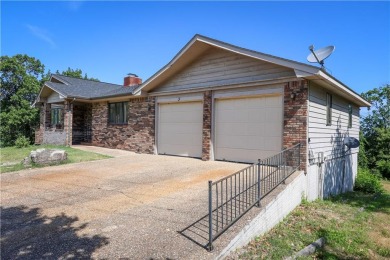 This beautiful home is located on the crest of the Ozark on Holiday Island Golf Course in Arkansas - for sale on GolfHomes.com, golf home, golf lot