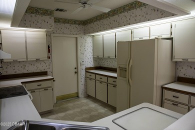 A 2 Bedroom with a Den/2 Bath end unit in the Woodside on Spruce Creek Golf Club in Florida - for sale on GolfHomes.com, golf home, golf lot