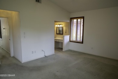 A 2 Bedroom with a Den/2 Bath end unit in the Woodside on Spruce Creek Golf Club in Florida - for sale on GolfHomes.com, golf home, golf lot
